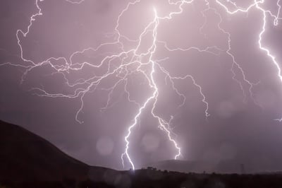 lightning bolt striking hill